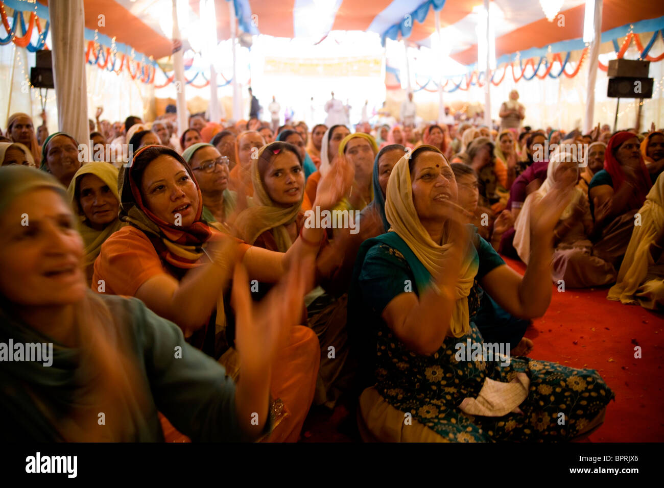 Woman followers of a Baba during the Kumbh Mela festival Haridwar, Uttarakhand, India 2010. Stock Photo