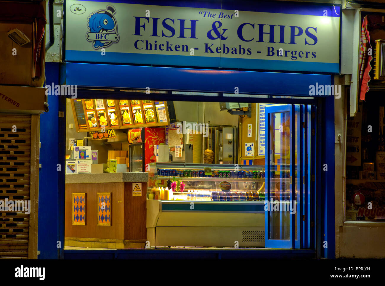 Fish And Chip Shop At Night Stock Photo