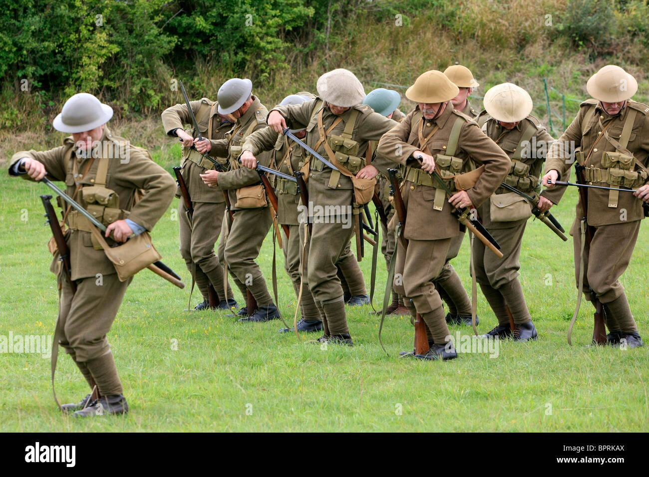 Group of WW1 British re-enactment group demonstrate Army bayonet drill ...