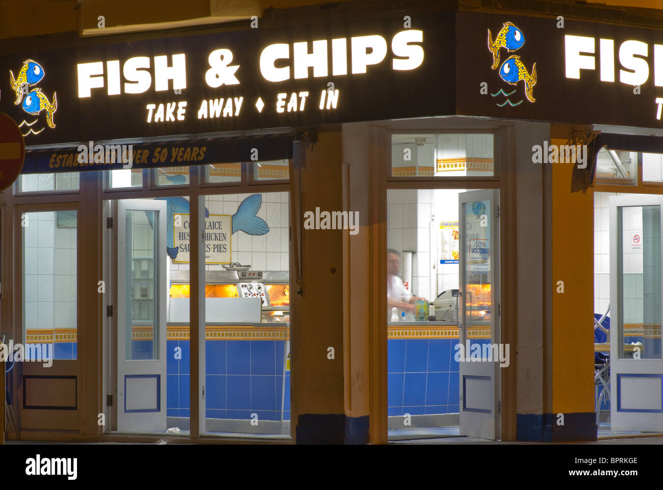 Fish and chip shop sign illuminated at night hires stock photography and images Alamy