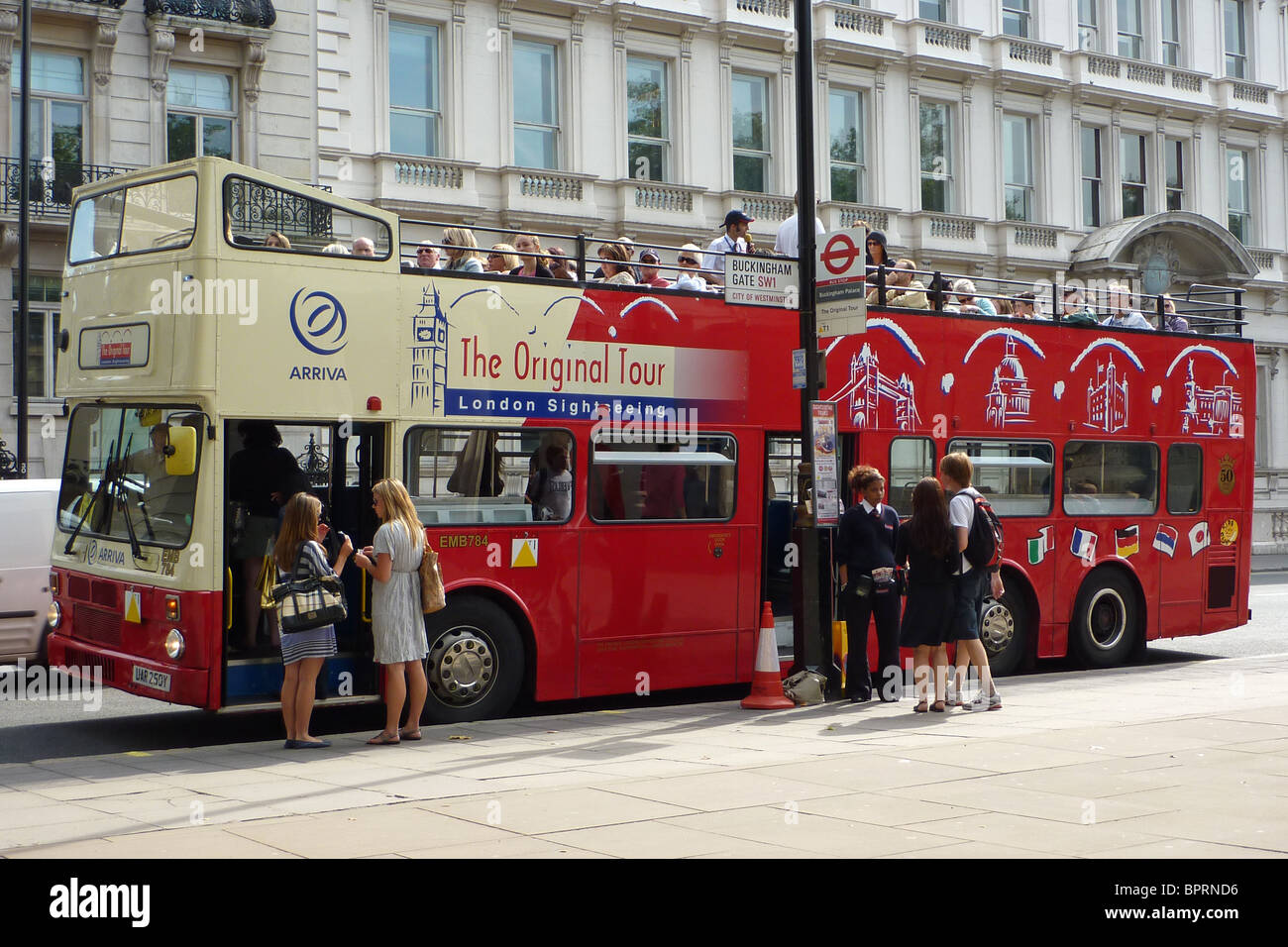 Tourists joining a London tourist bus Stock Photo