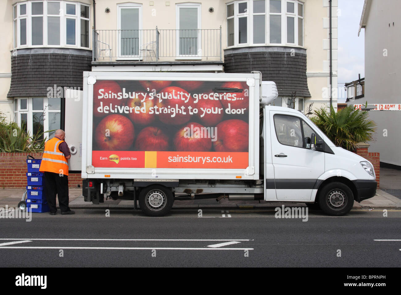 Sainsbury's online shopping home delivery van in a U.K. town. Stock Photo