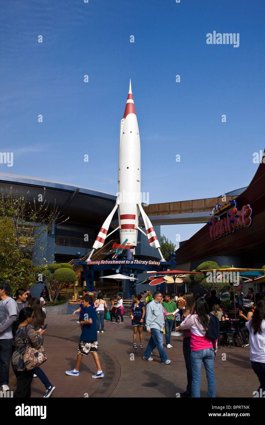 Crowds walk around a rocket ship, Disneyland Resort, Anaheim