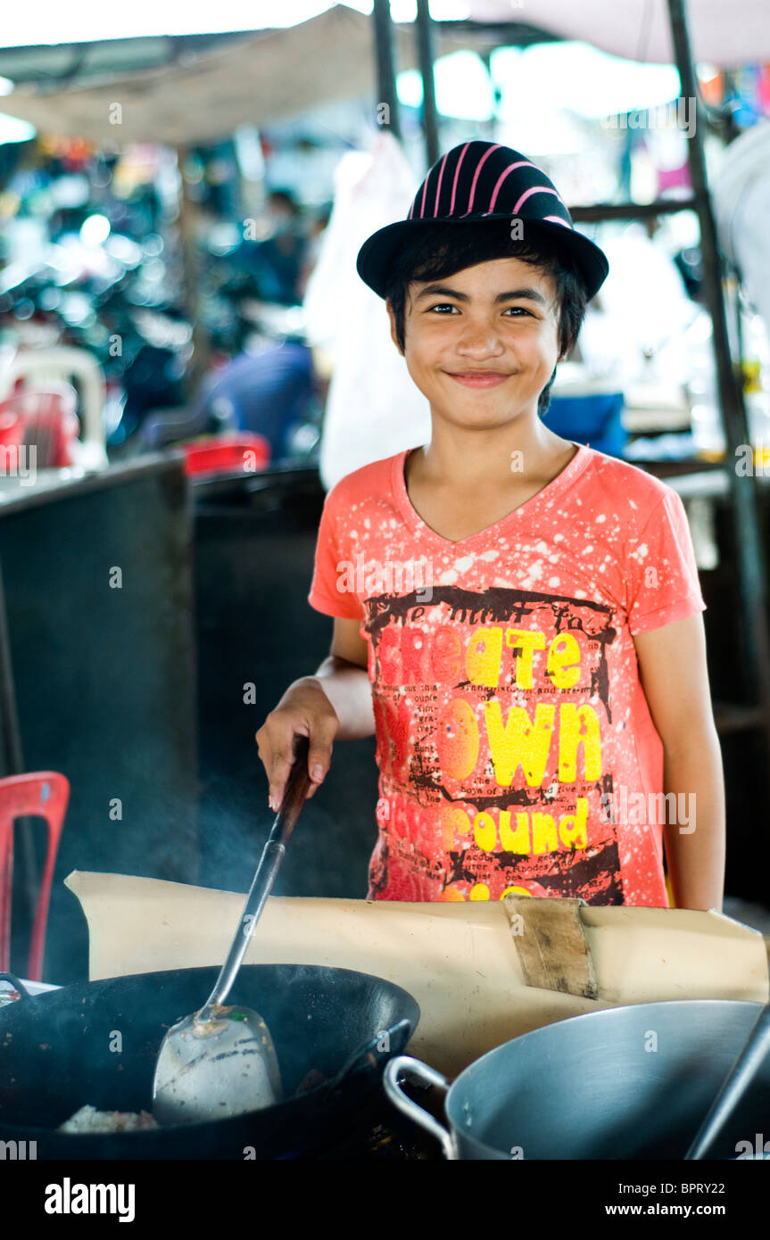 Young food hawker in market, Kompong Cham, Cambodia Stock Photo