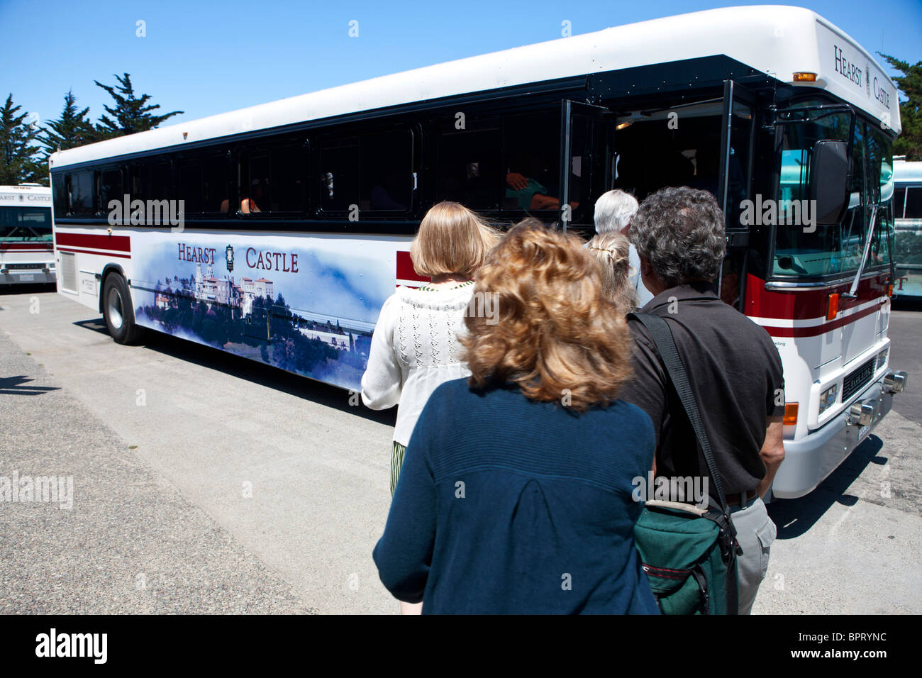 Tourists board a bus up to Hearst Castle, California, United States of America Stock Photo