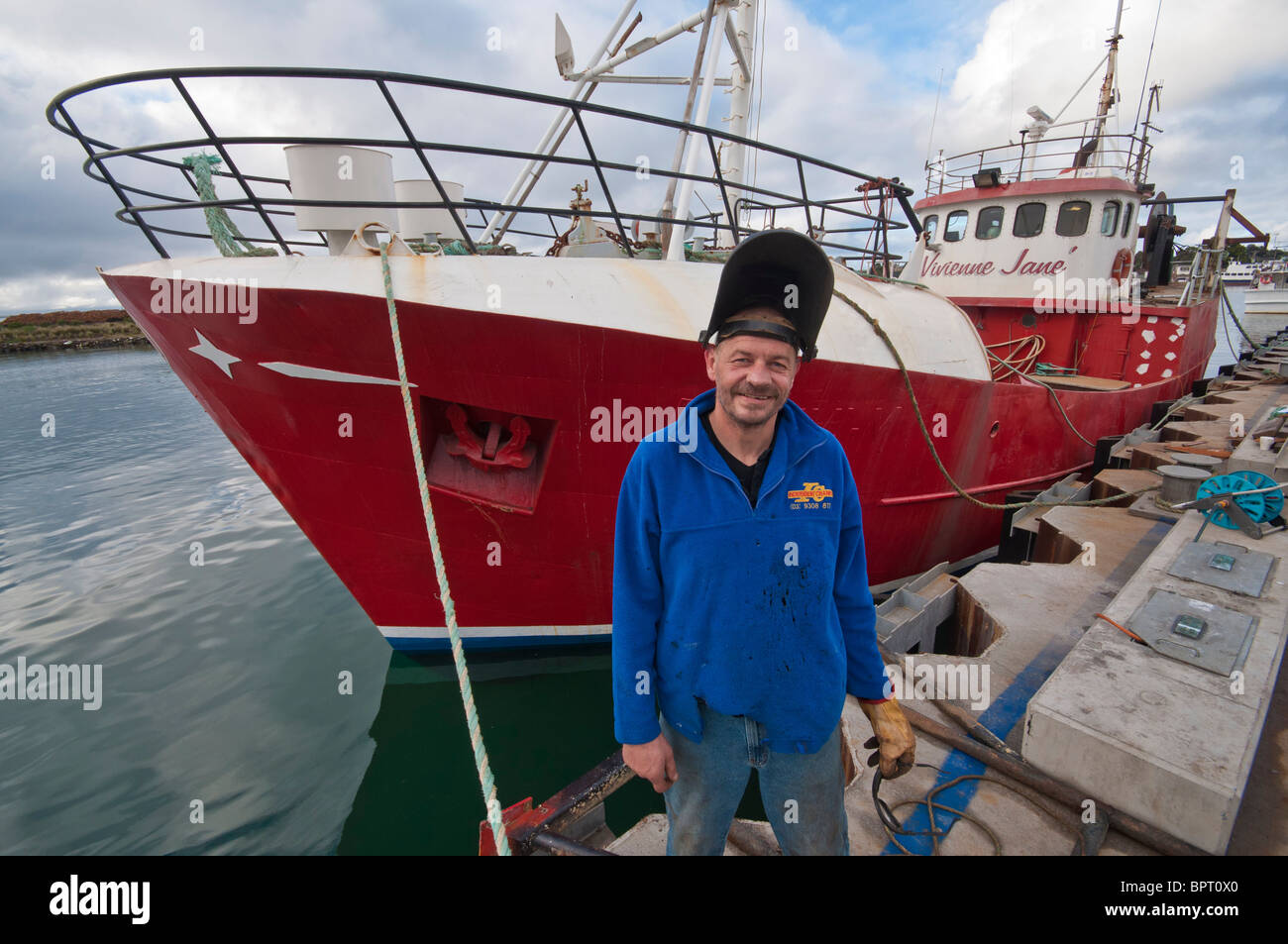 Ship's engineer, George Currie with the fishing boat, Vivienne Jane Stock Photo