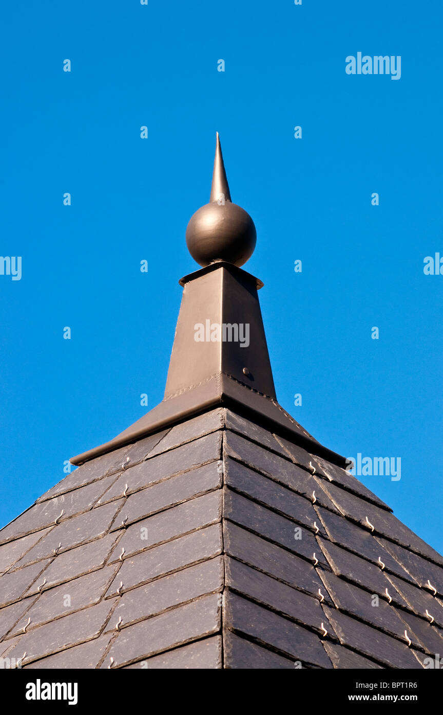 Decorative finial / slate roof detail - France. Stock Photo