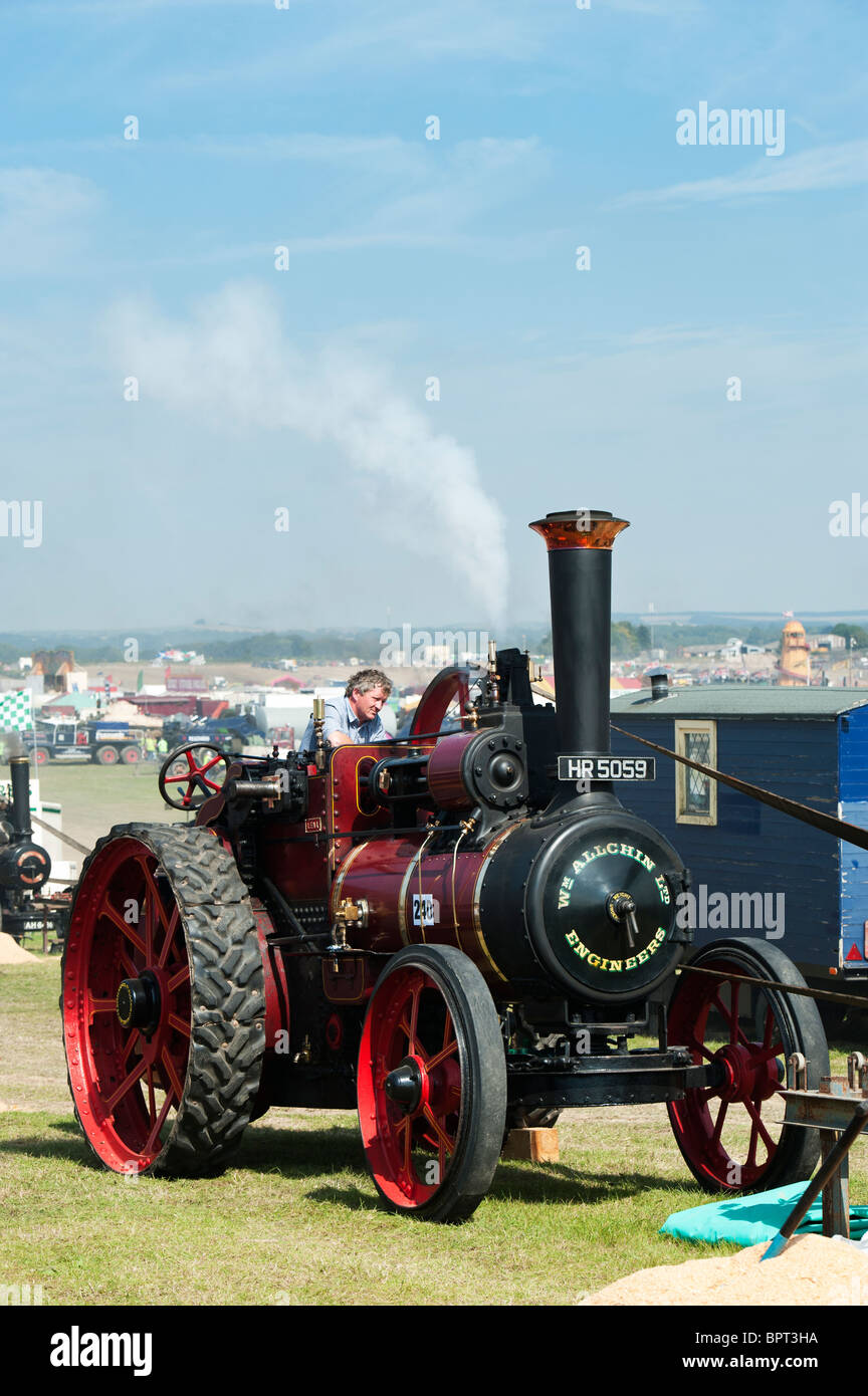 Vintage Steam traction engine powering a wood saw at Great Dorset steam fair in England Stock Photo