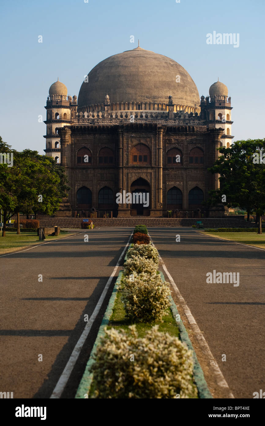 A walkway leads to the Golgumbaz, a Mughal mausoleum in Bijapur, India. Stock Photo