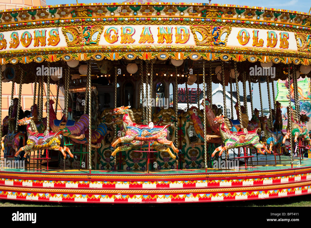 Steam Galloping horse carousel, fairground ride at the Great Dorset steam fair 2010, England Stock Photo