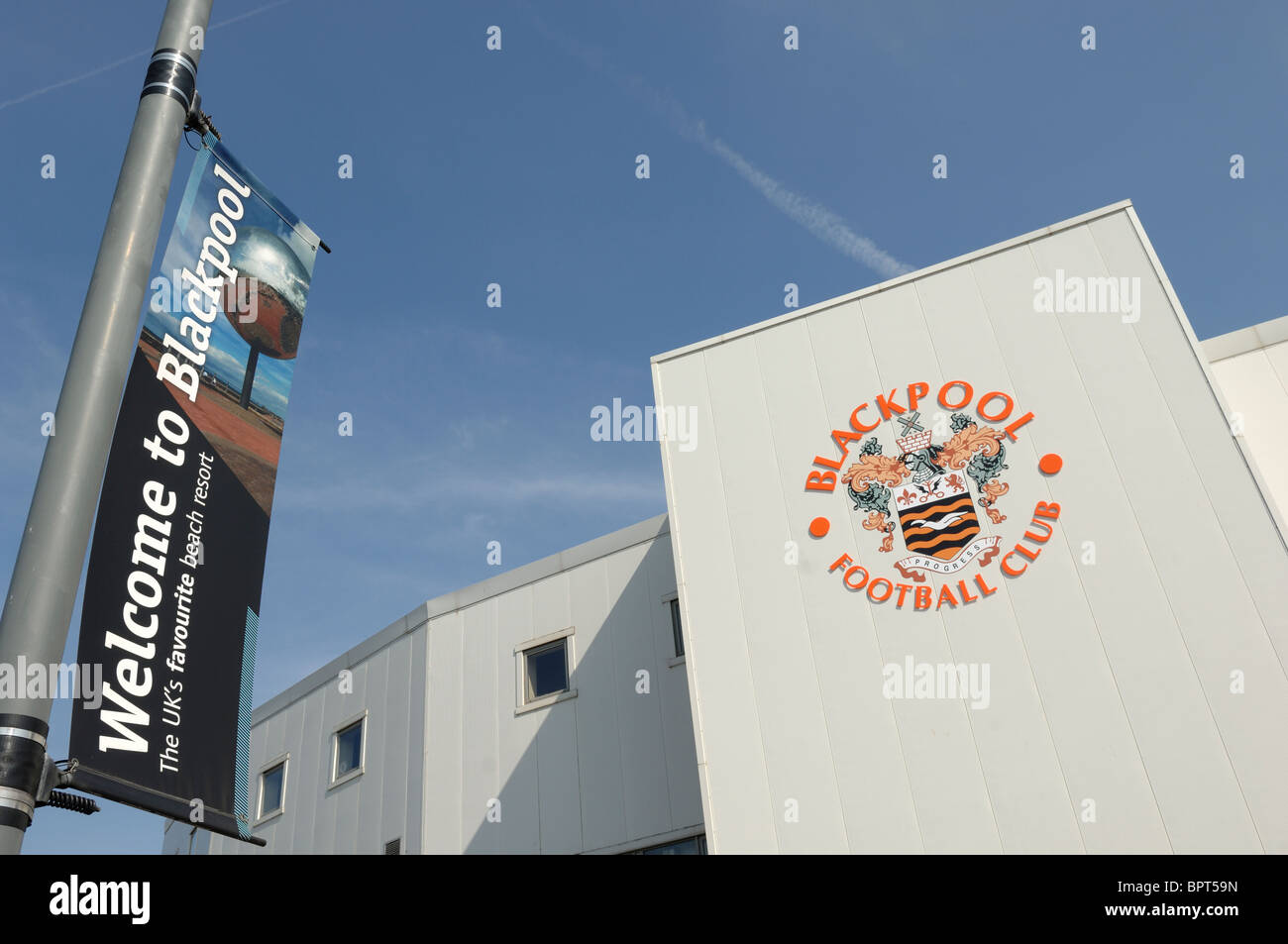 Blackpool Football Clubs Bloomfield Road stadium set against a blue sky. Stock Photo