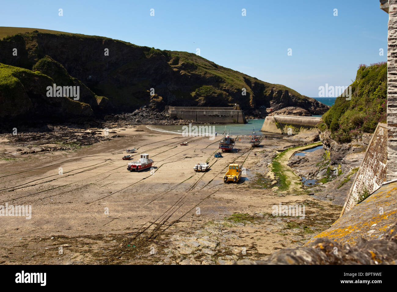 Port Isaac in Cornwall England, fishermen waiting for the tide to return Stock Photo