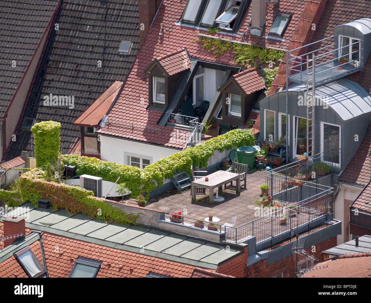A roof terrace / rooftop garden in the old town of Freiburg im Breisgau in Southern Germany. Stock Photo