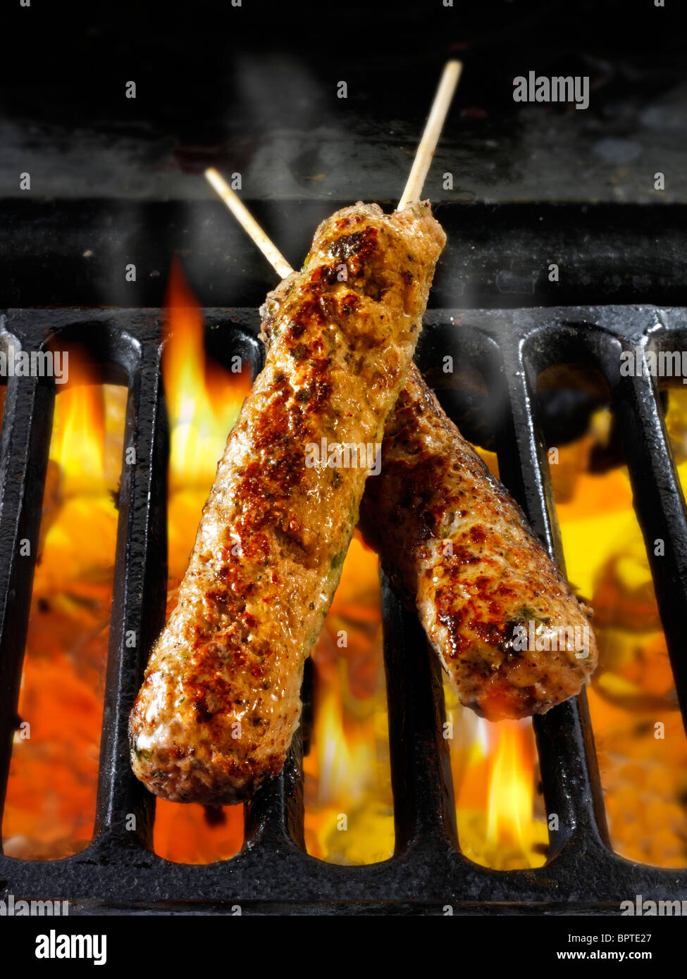 Lamb & mint kebabs being cooked over hot charcoal. Food photos