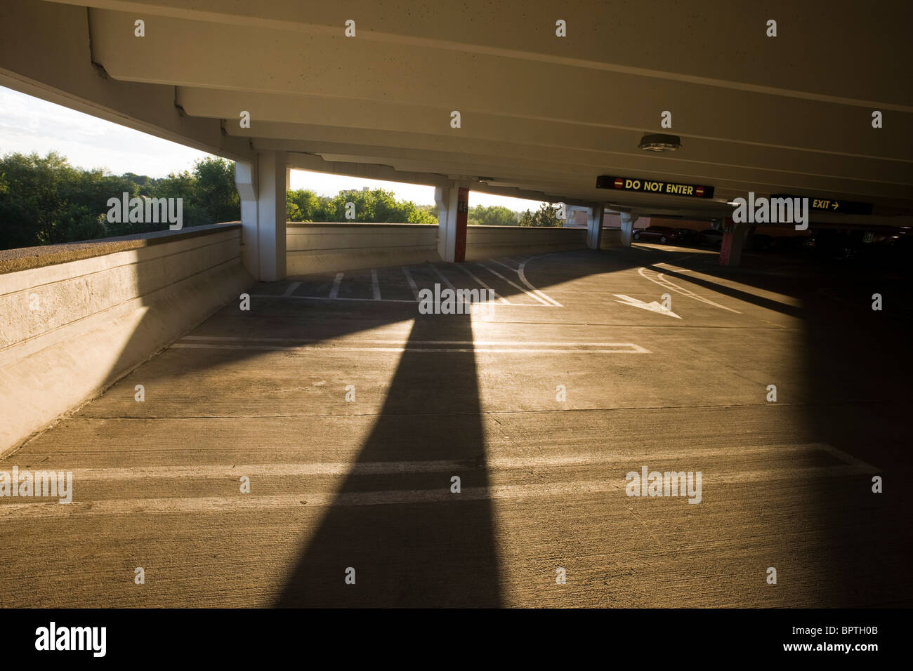Late day shadows cast inside a concrete parking garage at Cherry Creek Mall, Cherry Creek, Denver, Colorado, USA Stock Photo