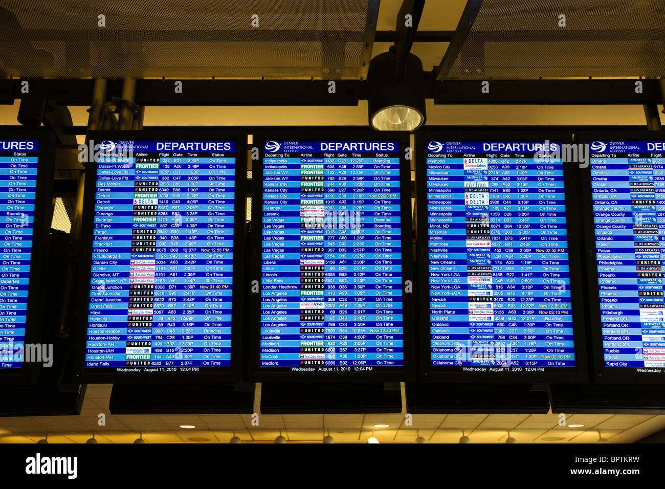 Flight arrival departure information computer monitor displays at the Denver International Airport, Denver, Colorado, USA Stock Photo