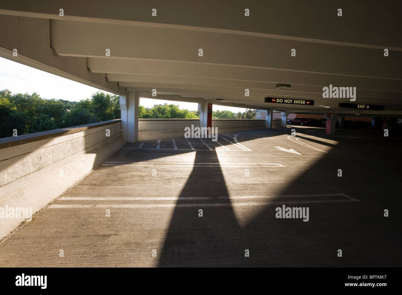 Late day shadows cast inside a concrete parking garage at Cherry Creek