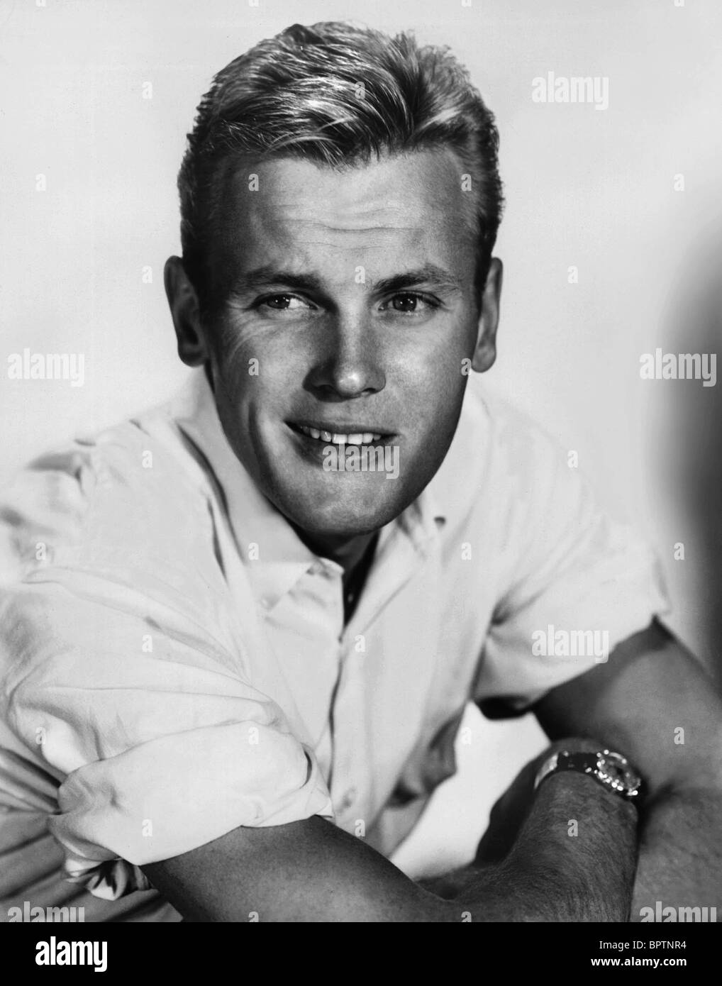 Actor Tab Hunter, left, with actress Tuesday Weld at a dinner