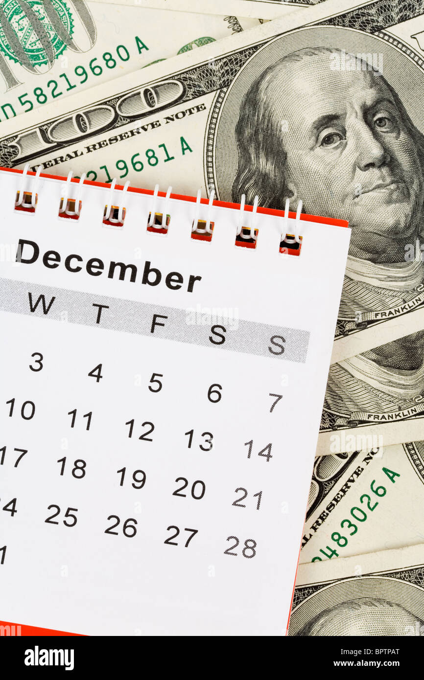 Calendar and dollar, December Stock Photo Alamy