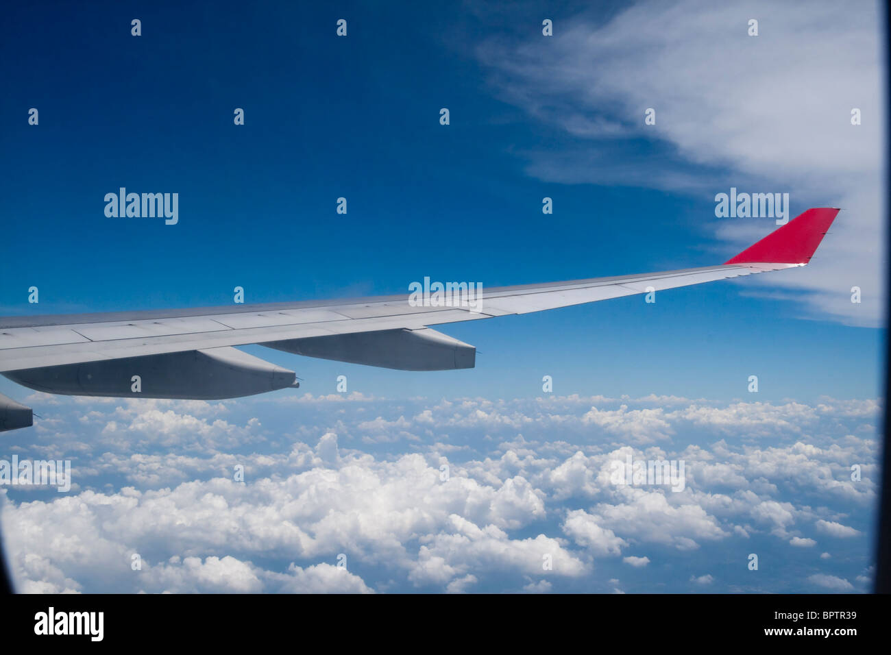 View of jet plane wing on a background of sky Stock Photo