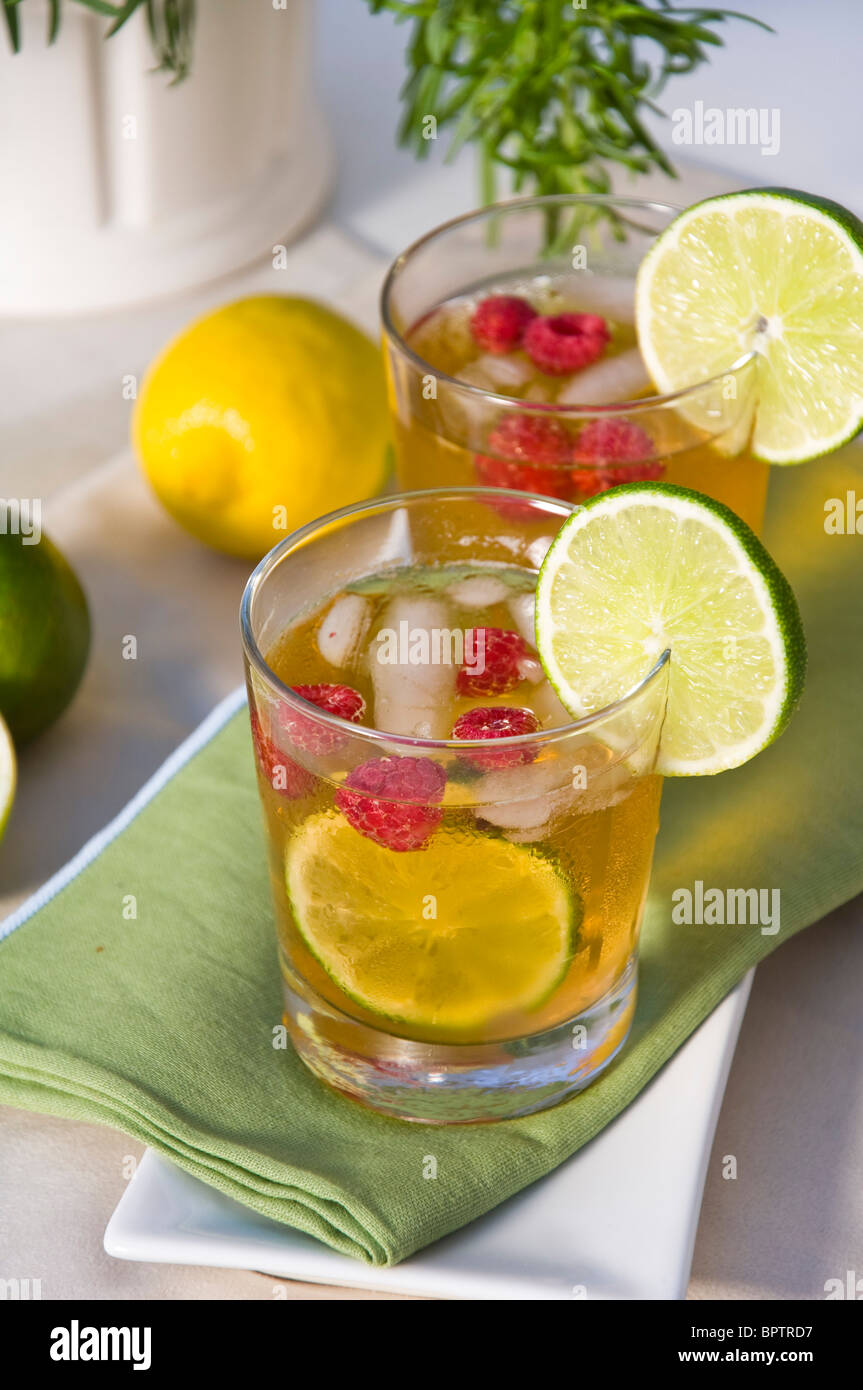 Iced Raspberry Lime Ice tea with raspberry and lime Stock Photo - Alamy