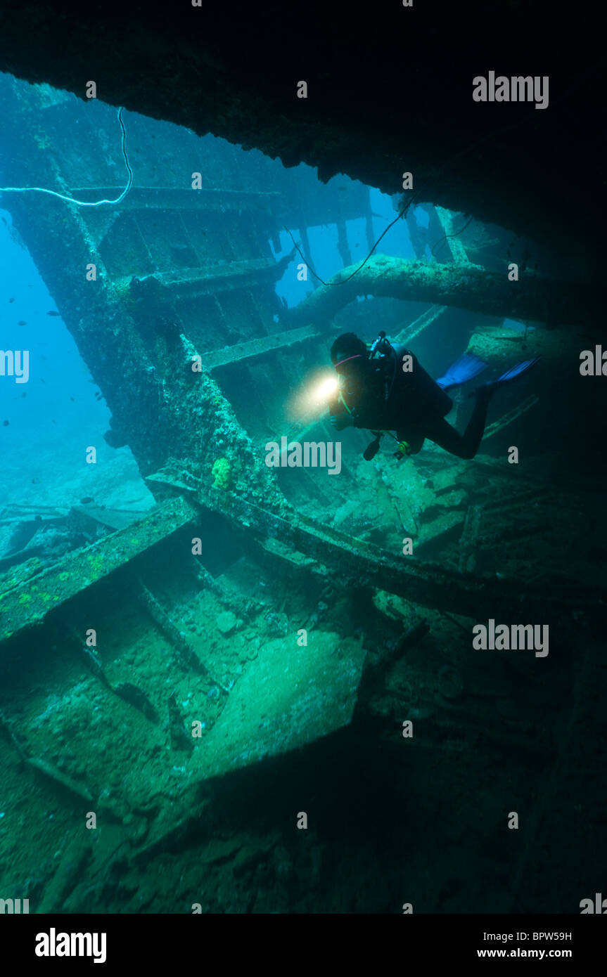 Diver exploring an unidentified wreck, Manokwari, West Papua, Indonesia. Stock Photo