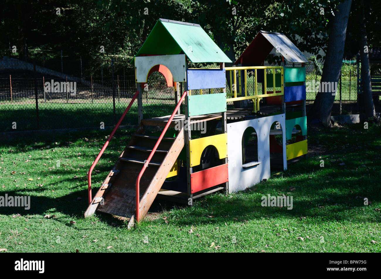 Very old childrens playpark  playhouse in a field Stock Photo