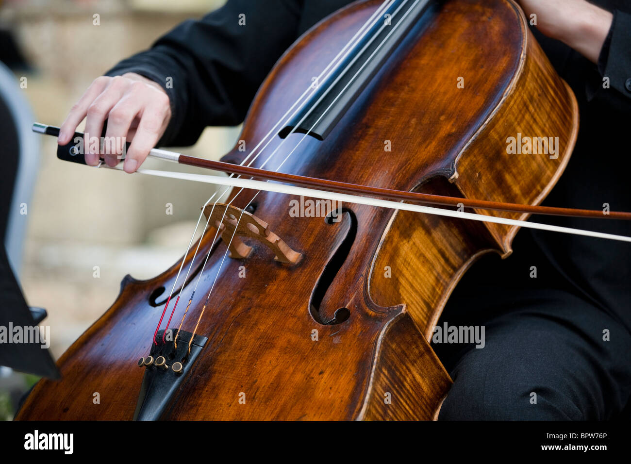Cellist playing cello Stock Photo