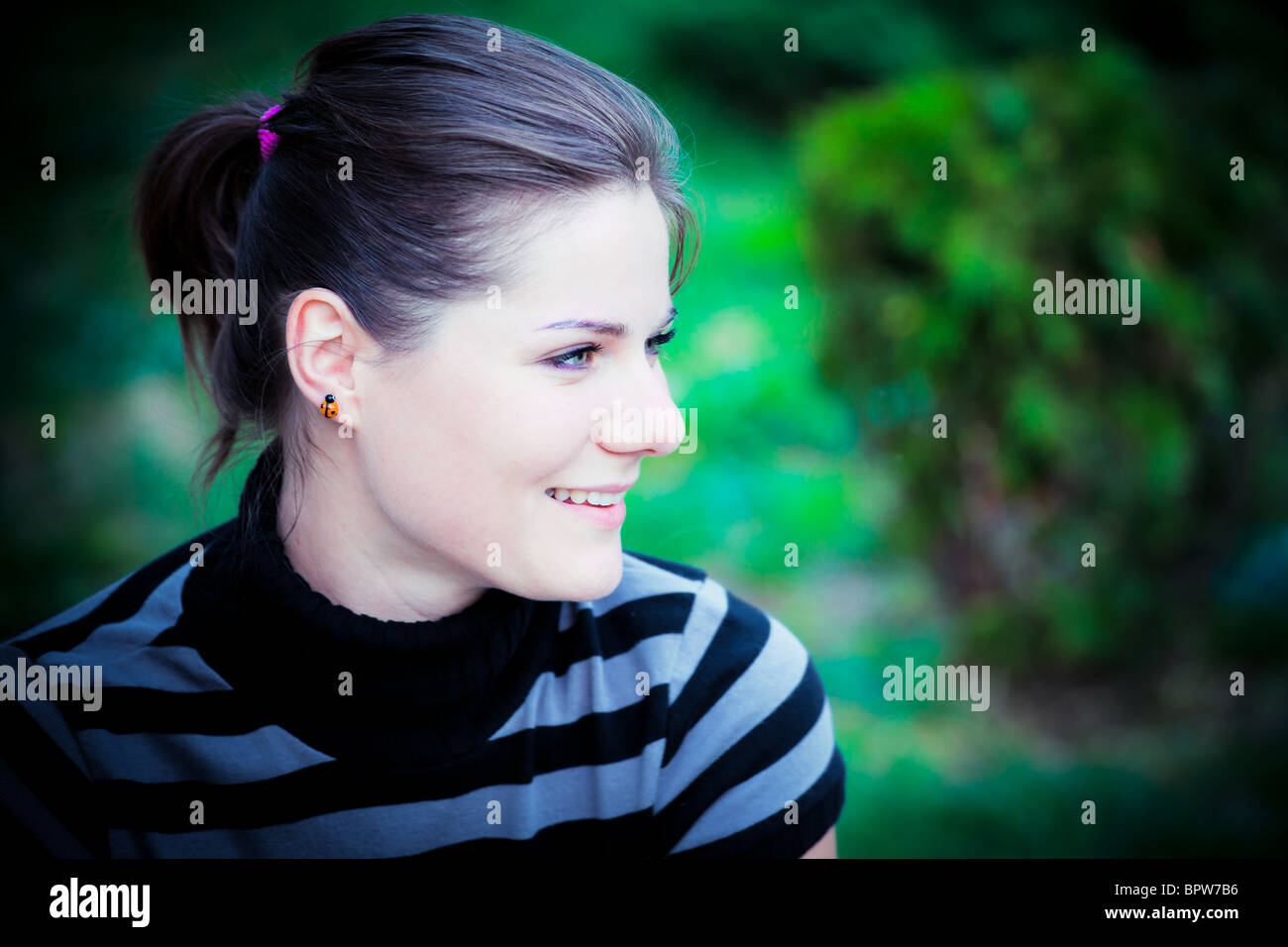 Portrait of a young woman outdoor Stock Photo - Alamy
