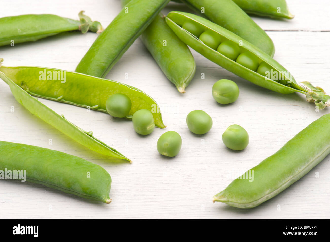 Freshly Picked Garden Peas On A Kitchen Table Stock Photo
