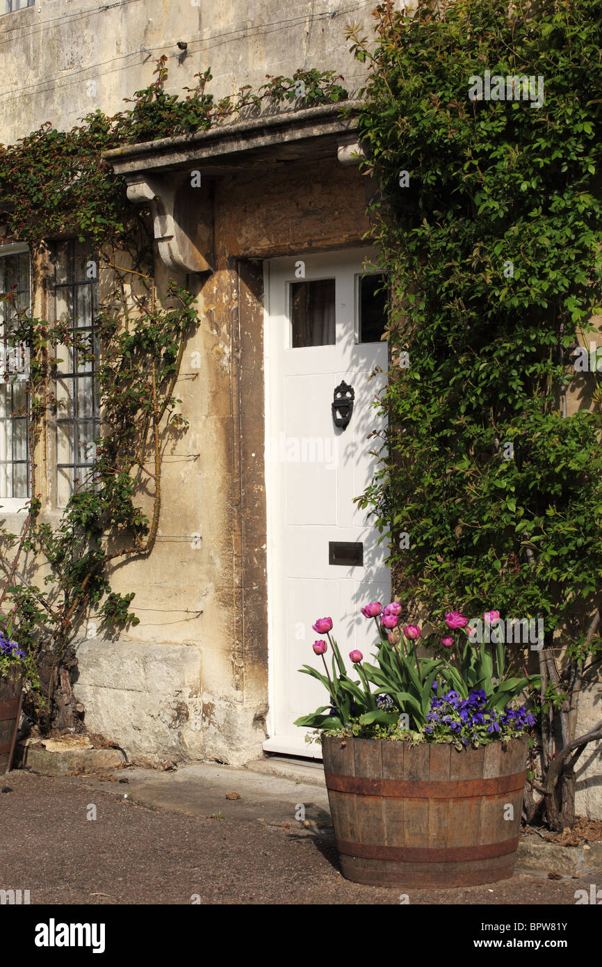 White front door of a house in Lacock village, Wiltshire, England, UK Stock Photo