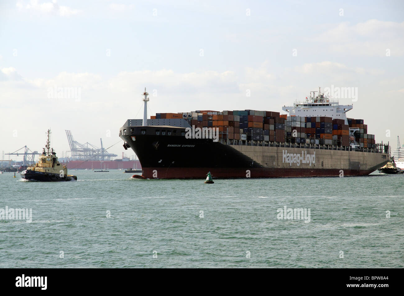 Tug boat guiding ship hi-res stock photography and images - Alamy