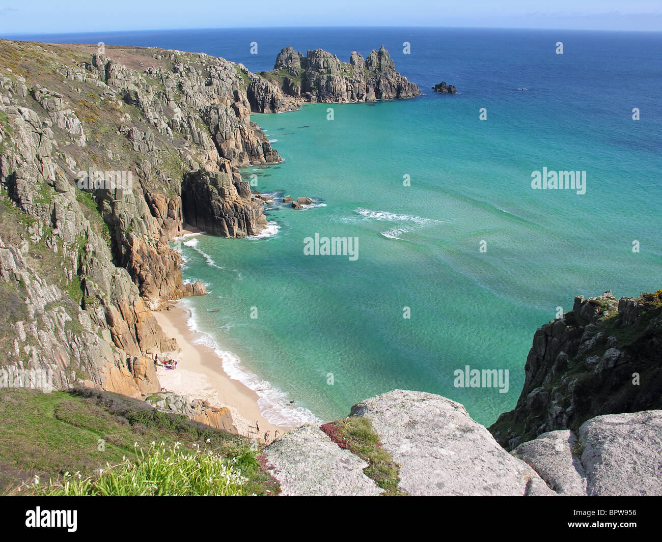 Pednvounder beach, Treen Cliff and Treryn Dinas headland site of the Logan Rock; near Porthcurno, Cornwall, UK Stock Photo