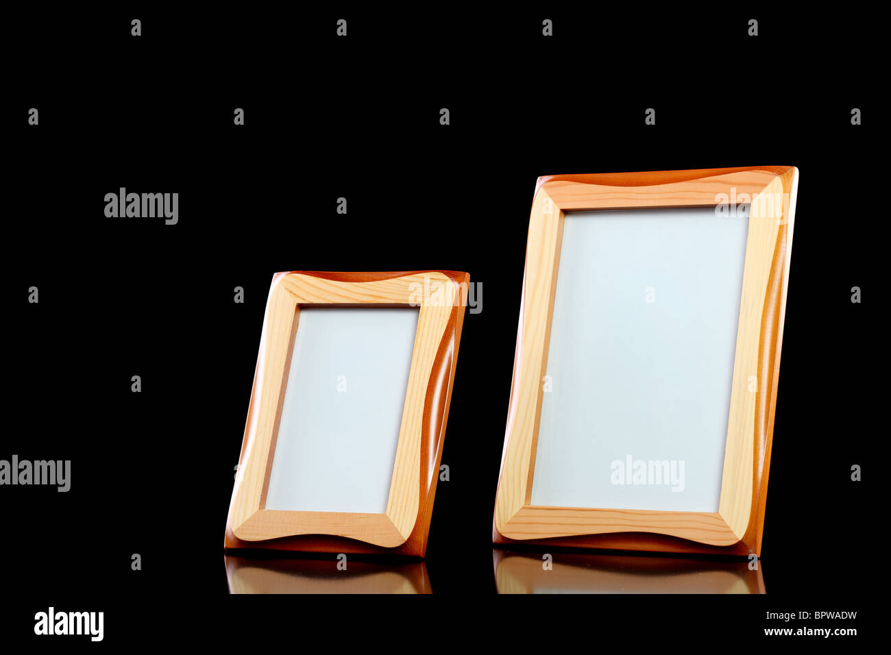 two wooden picture frames against black background Stock Photo