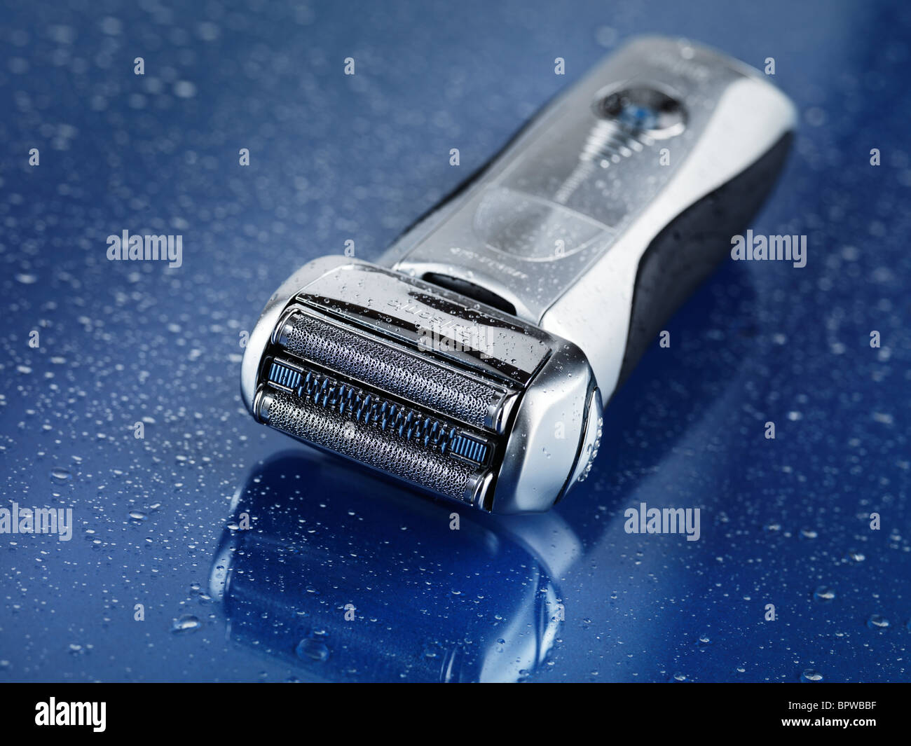 Braun 790CC - 9595 Pulsonic electric shaver on wet blue glass background  with water drops on it Stock Photo - Alamy