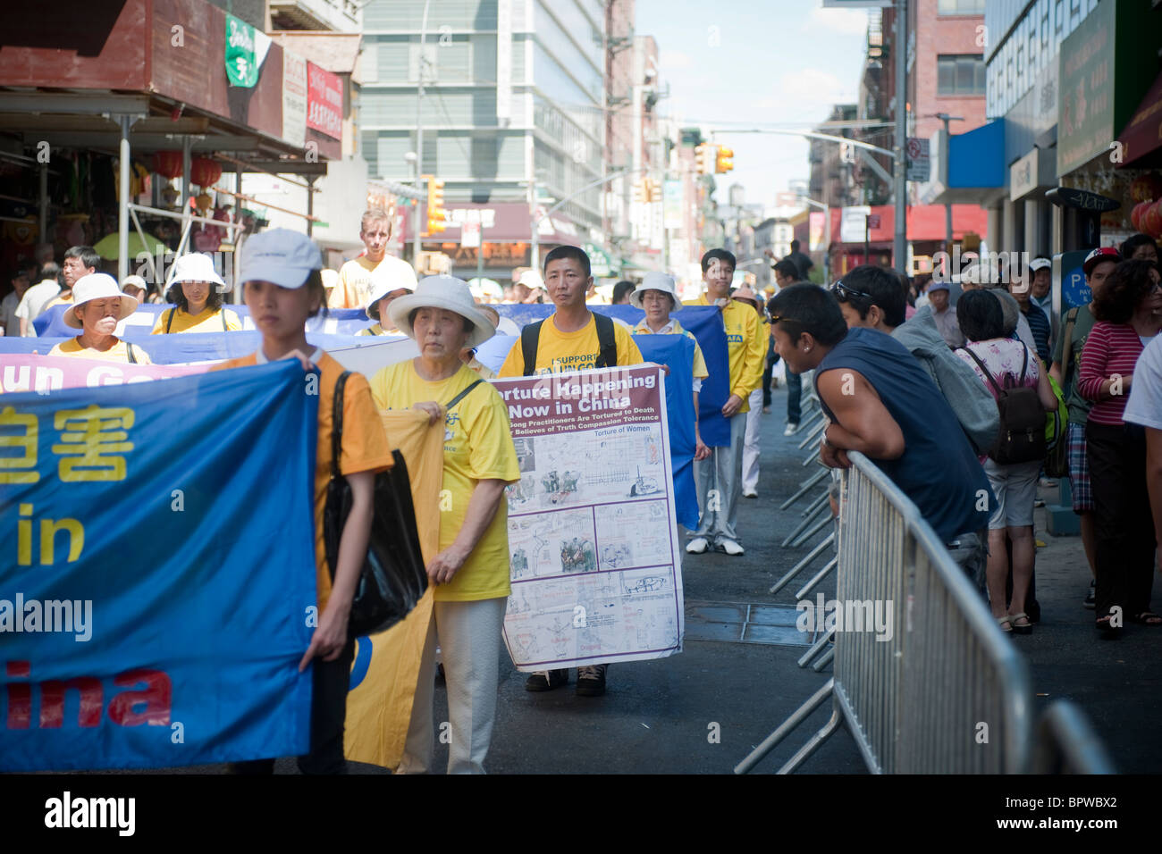 Members of Falun Dafa (Falun Gong) from around the world parade through