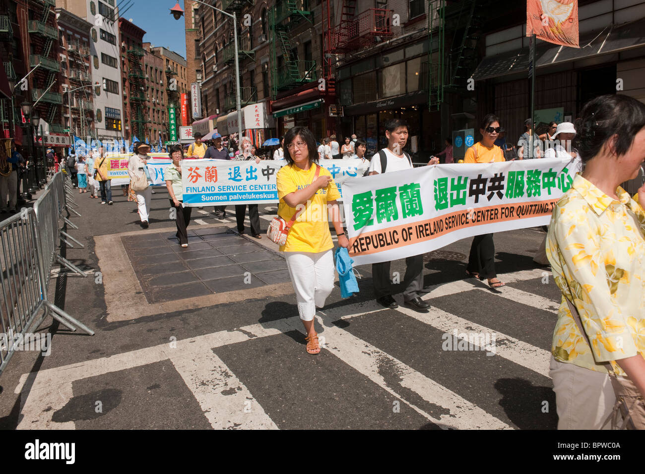 Members of Falun Dafa (Falun Gong) from around the world parade through
