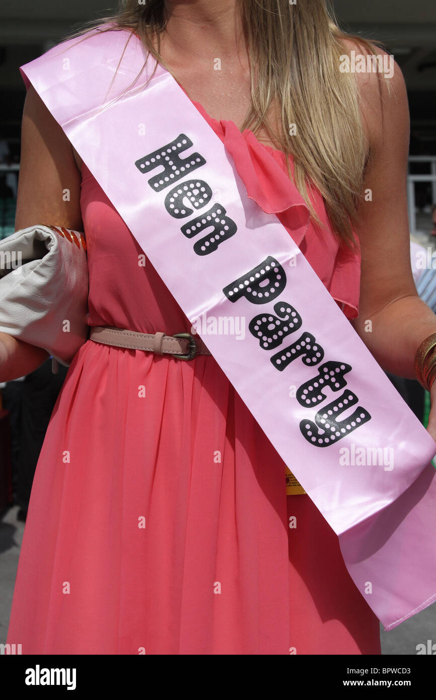 Woman wearing pink hen party banner sash at the Betfred Sprint Cup Race meeting, Haydock Park Saturday 4th September, 2010 Stock Photo