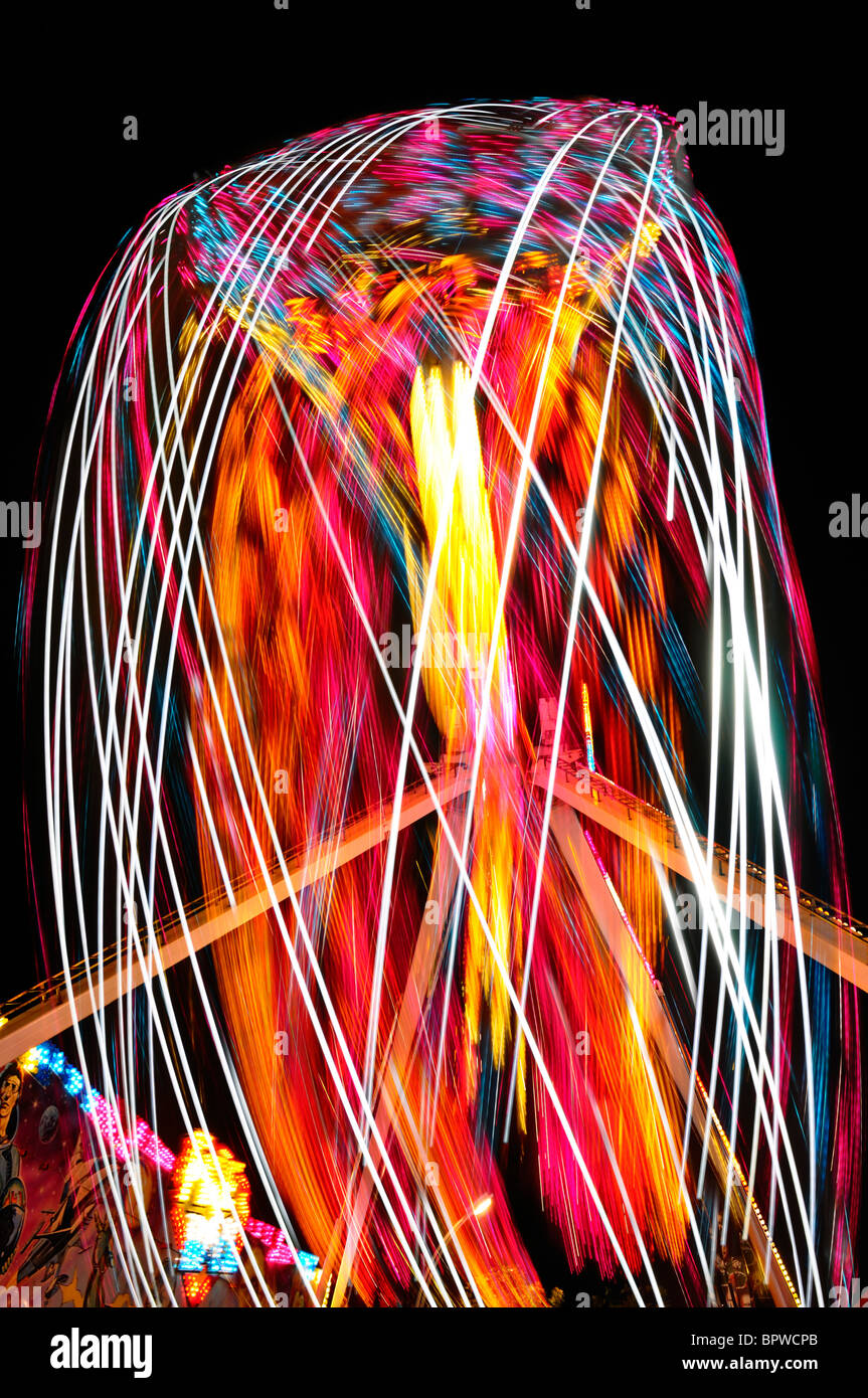 Bright abstract light painting at night from the FireBall ride at the Toronto CNE fair Stock Photo