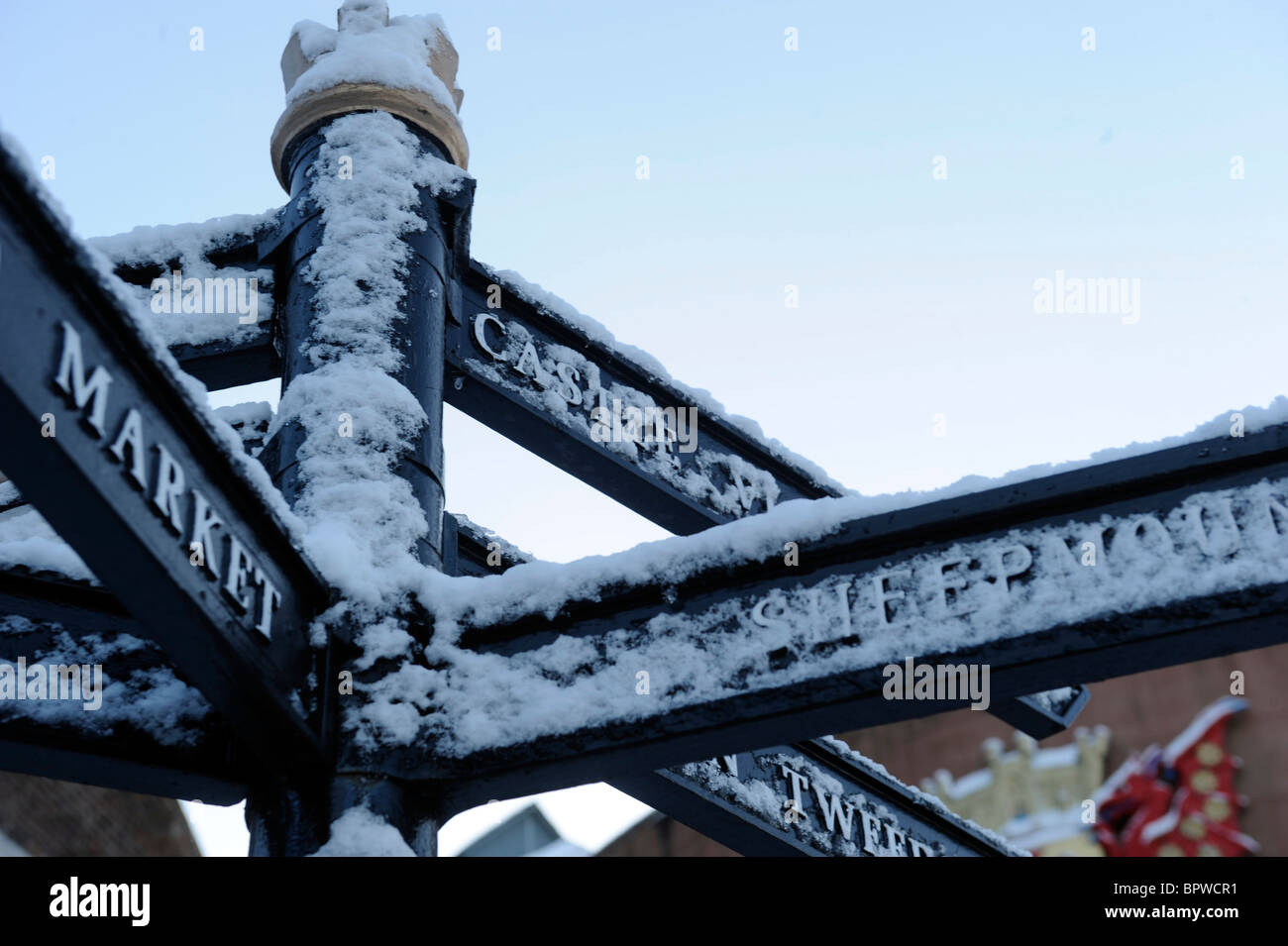 Signpost for historic sites in Carlisle covered in winter snow Stock Photo