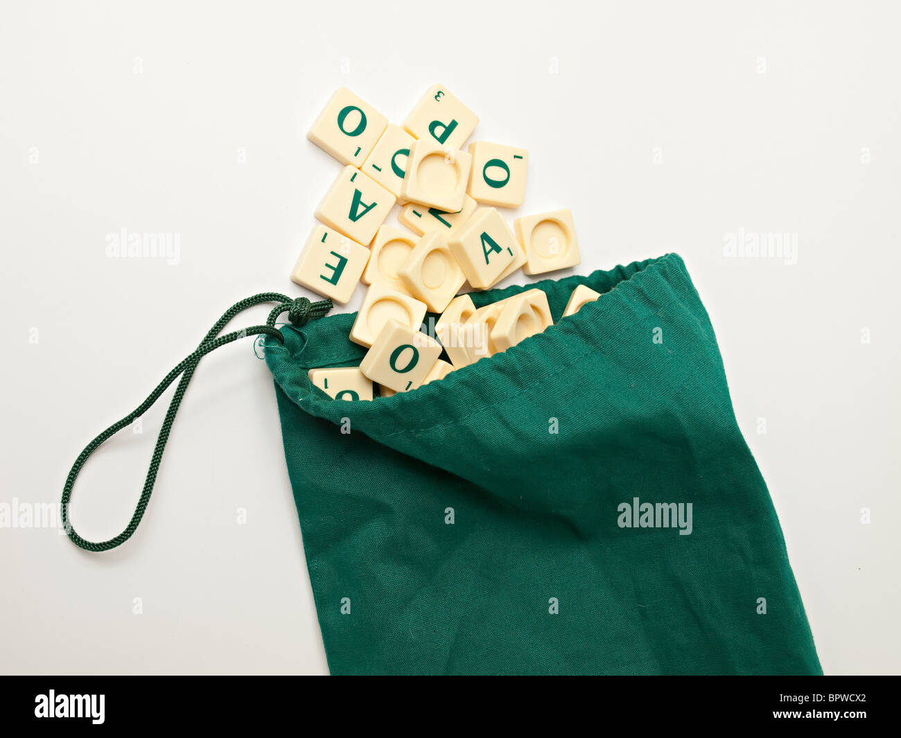 Bag with scrabble tiles falling out Stock Photo