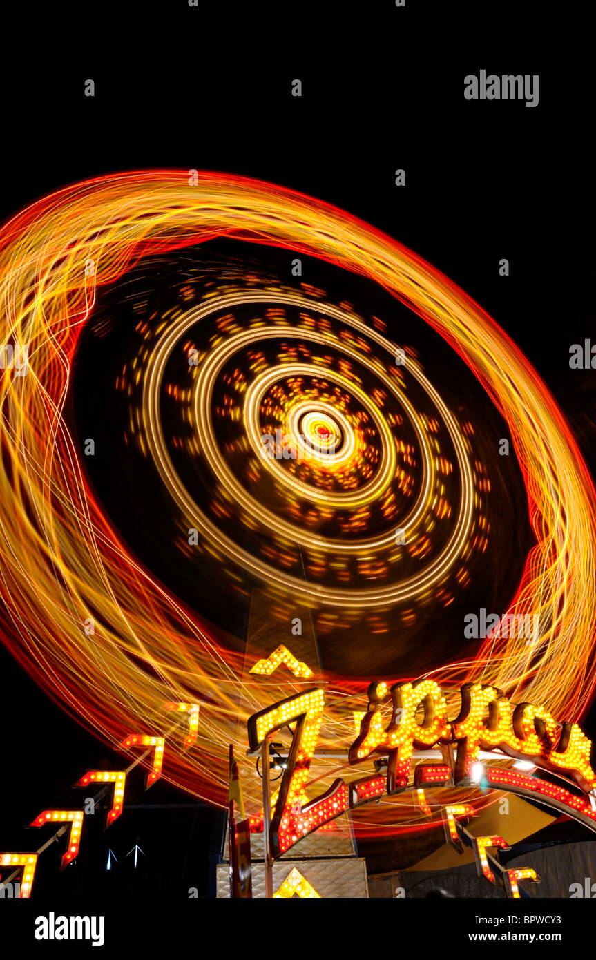 Light painting streaks at night from the Zipper ride at the Toronto Canadian National Exhibition CNE funfair midway fairgrounds Stock Photo
