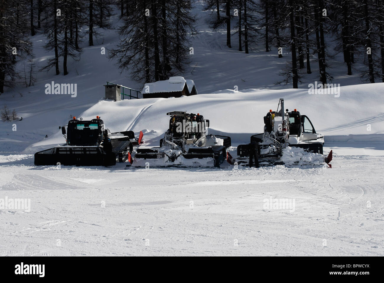 Winter sport. Skiing Sauze D'Oulx, Italy. Piste basher or bully. Tracked machine to prepare the piste or ski slope for skiing Stock Photo