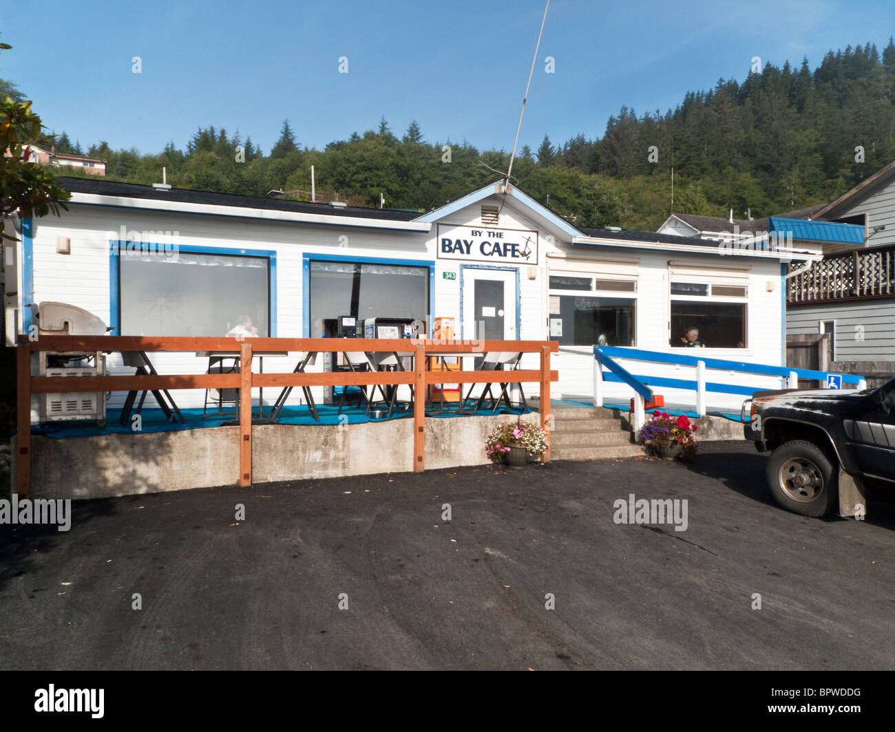 simple small waterfront cafe overlooking Clallam Bay with outside deck & wheelchair ramp in famed sportfishing town of Sekiu WA Stock Photo