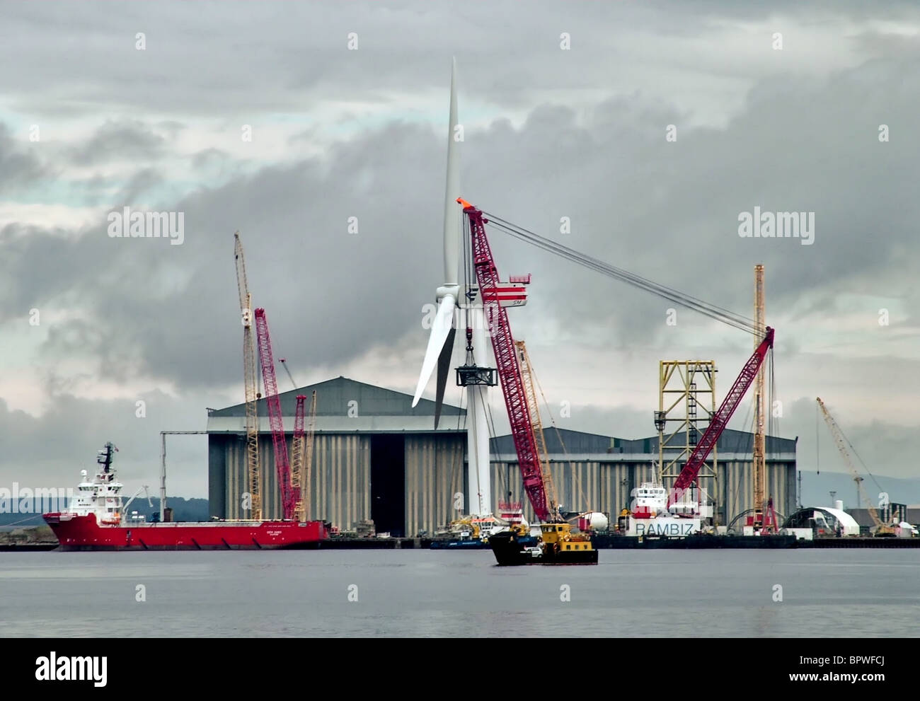 The Rambiz crane barge readies a giant off-shore wind turbine for installation in the Moray Firth at the Nigg Yard, Cromarty Stock Photo