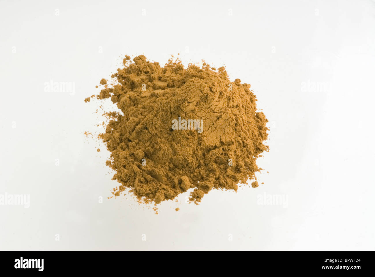 A pile of the spice Cinnamon, on a white background. Stock Photo