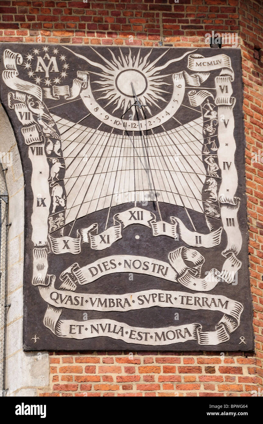 Sun dial on Mariacki Church, St Mary's Church in Rynek Glowny, Town Square in Krakow Stock Photo