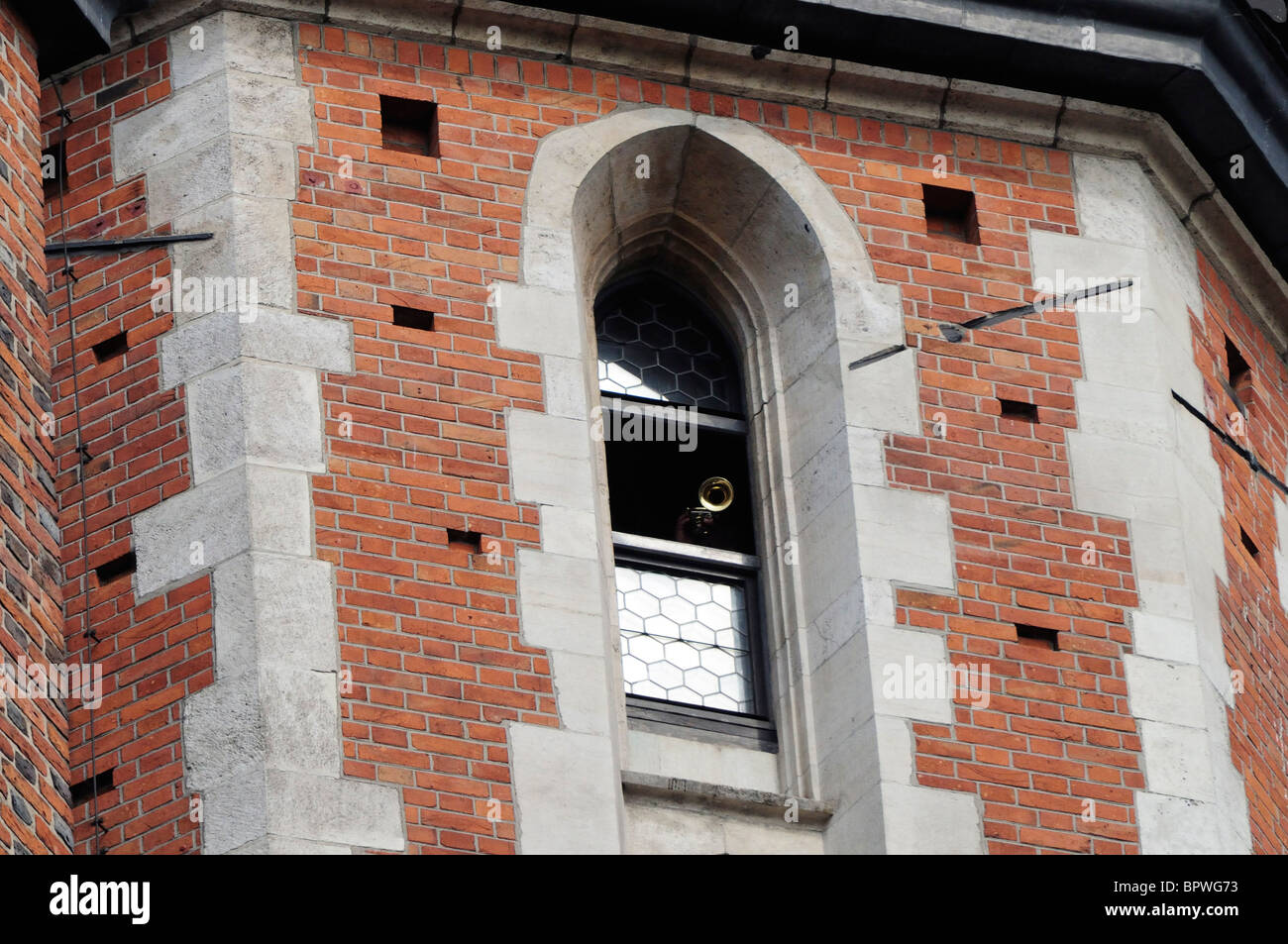 Bugler seen in window of Bugle-call Tower of Mariacki Church, St Mary's Church in Rynek Glowny Stock Photo