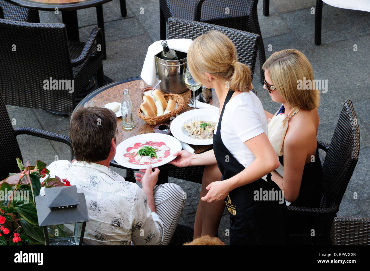 People eating and dinking at Wierzynek Restaurant, in Rynek Glowny, Town Square, in Krakow Stock Photo