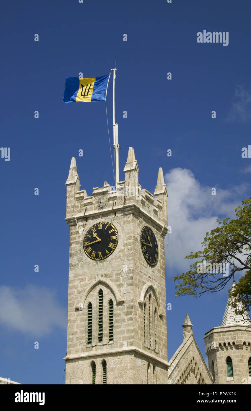 The National Flag of Barbados flying on the clock tower of Parliament